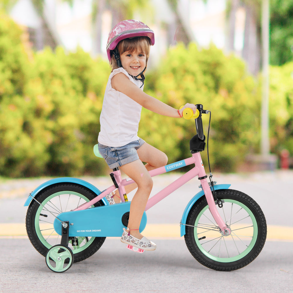 Kids bike in pink with training wheels, showcasing a child riding confidently with a stylish helmet for added safety.