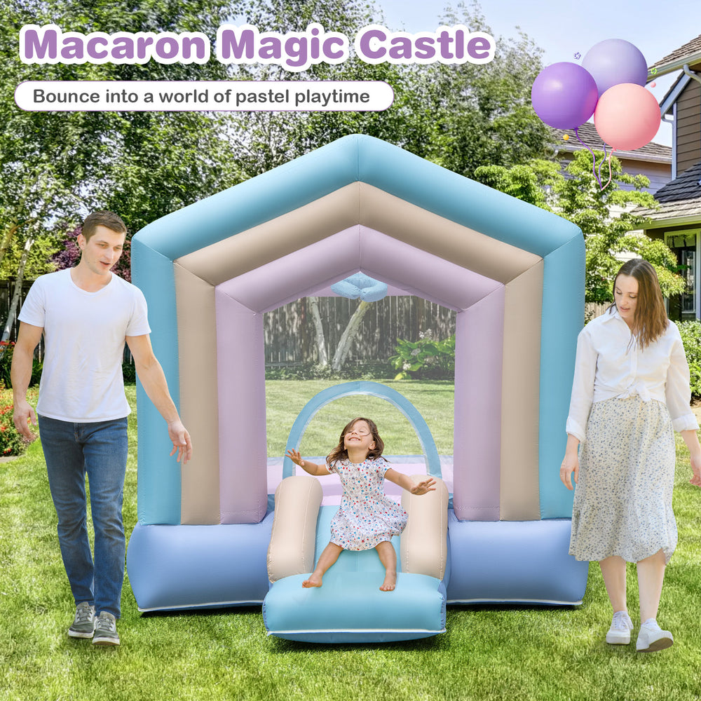 Kids bounce house with slide and basketball rim in pastel colors, perfect for energetic playtime in the backyard.