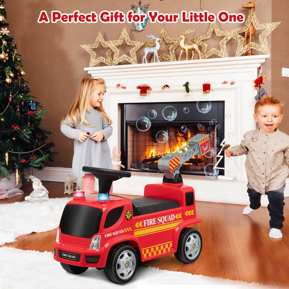 Kids push ride-on fire truck in red with ladder, headlights, and bubble maker, perfect for ages 18-36 months.