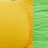 Close-up of the yellow and green waterproof oxford cloth on the kids inflatable water slide for summer fun.