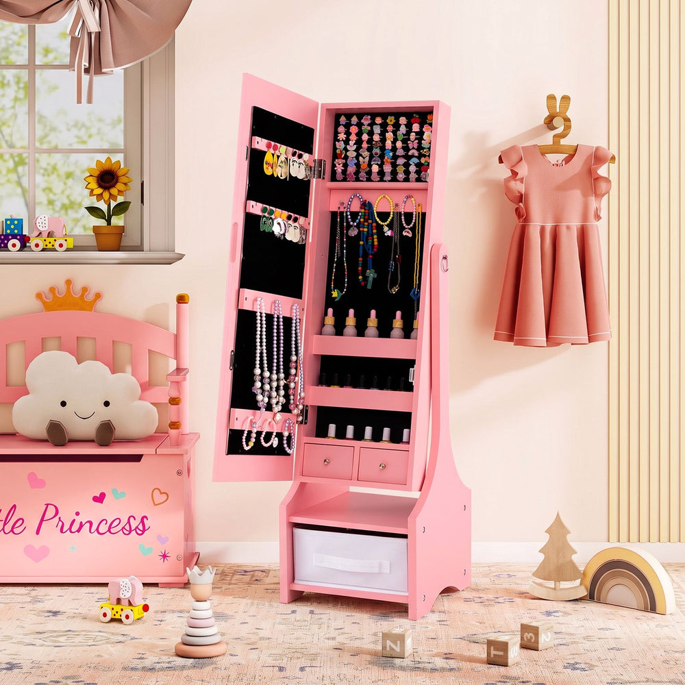 Pink kids jewelry armoire cabinet with full-length mirror and organized storage slots, shown open in a bedroom.