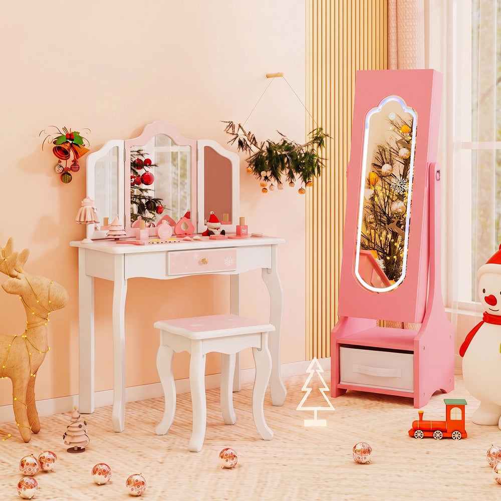 Pink kids jewelry armoire with LED full-length mirror, shown open with organized storage slots and drawers in a child’s room.