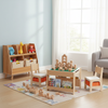 Kids 4-in-1 activity table set with natural wood finish, paired with a blue swivel chair and organized bookshelf for.