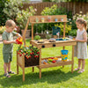 Kids play with the Costzon wooden mud kitchen featuring a planter box, stoves, sink, and 9 accessories for outdoor fun.
