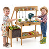 Wooden play kitchen with planter box, stoves, sink, and accessories, designed for outdoor pretend play for toddlers.