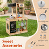 Kids outdoor wooden mud kitchen featuring a stove, sink, chalkboard, and organized utensils for imaginative play.