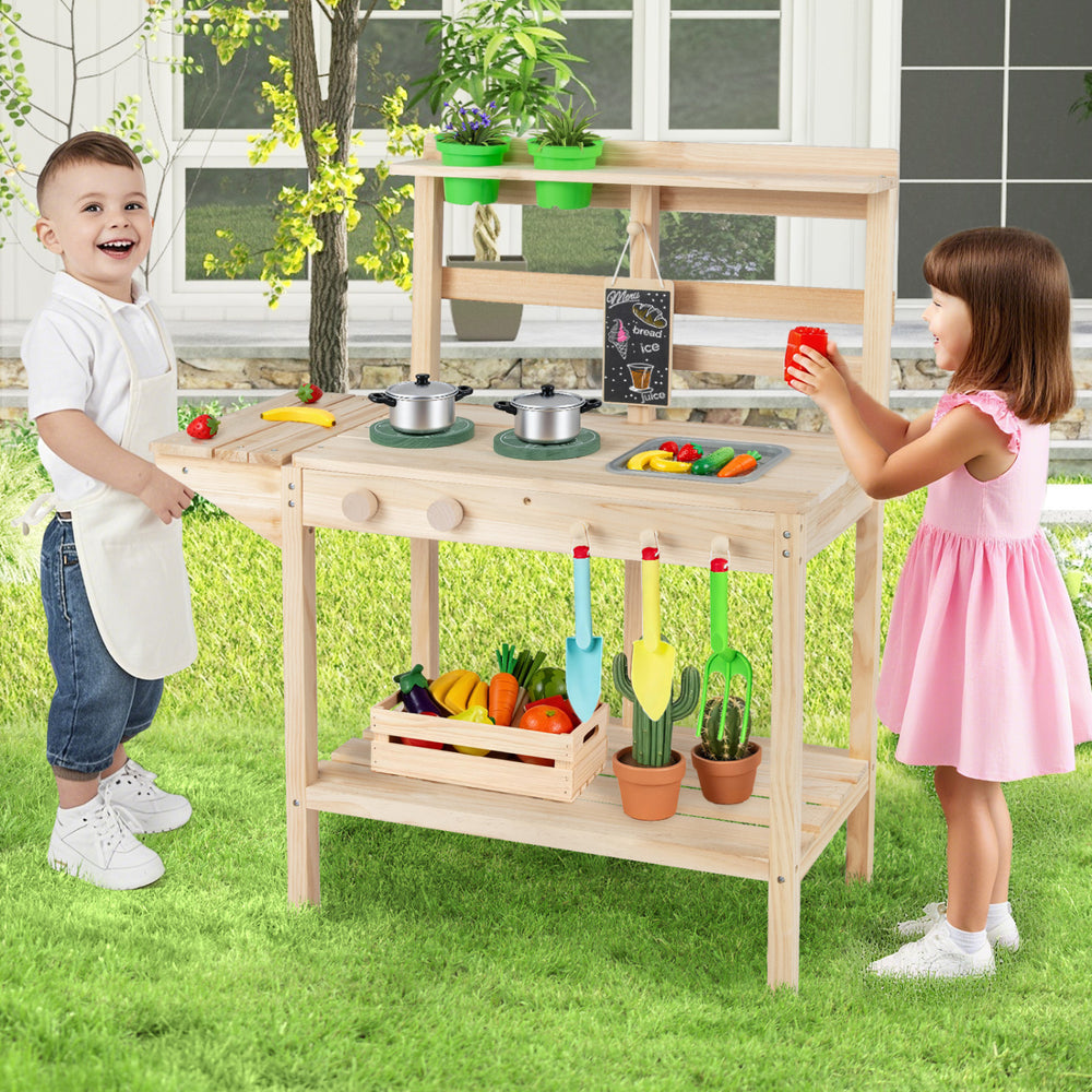 Kids play kitchen set featuring wooden stoves, vegetables, and pots, perfect for imaginative play in natural wood.