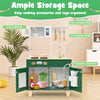 Kids play kitchen in green featuring a microwave, top shelf, and storage cabinets for imaginative cooking play.