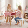 Kids pretend nail salon playset in pink with wooden legs, featuring a table and stool for creative play and storage.