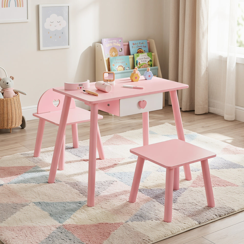 Kids pink pretend nail salon playset with wooden table, two stools, and ample storage for creative activities.