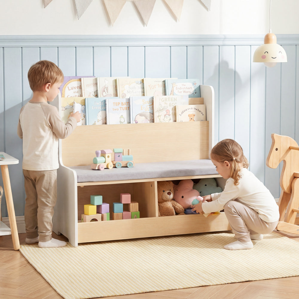 Kids Reading Nook featuring a white bookshelf, bench, and toy storage with a comfy detachable seat cushion for playtime.
