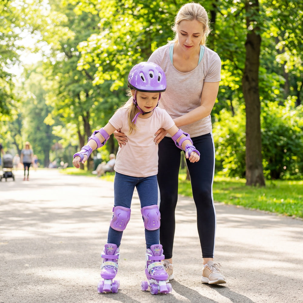 Adjustable purple kids roller skates with light-up wheels, worn by a child, for fun and safety during outdoor skating.