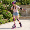 Kids roller skates in pink with light-up wheels, adjustable sizes, and protective gear for safe outdoor skating fun.