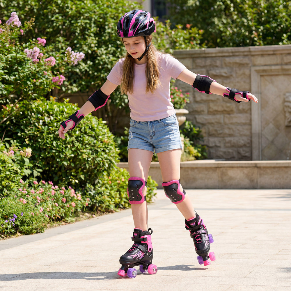 Kids roller skates in pink with light-up wheels, adjustable sizes, and protective gear for safe outdoor skating fun.