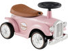 Vintage pink kids' sit-to-stand vehicle with working steering wheel and under-seat storage for fun rides.