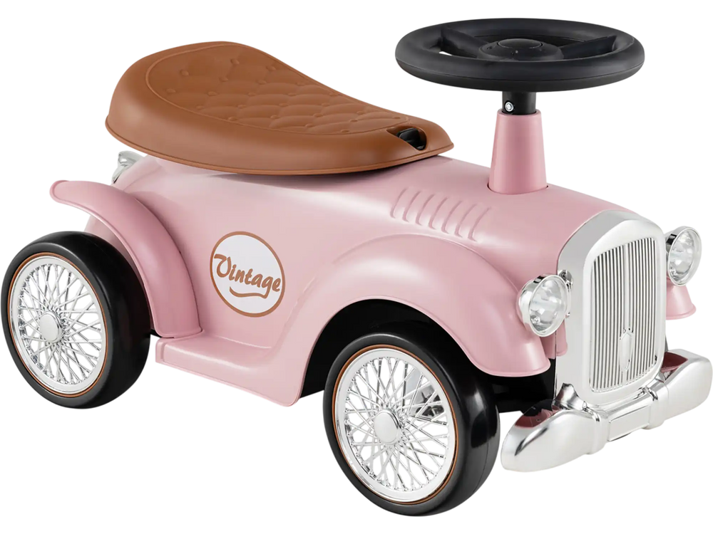 Vintage pink kids' sit-to-stand vehicle with working steering wheel and under-seat storage for fun rides.