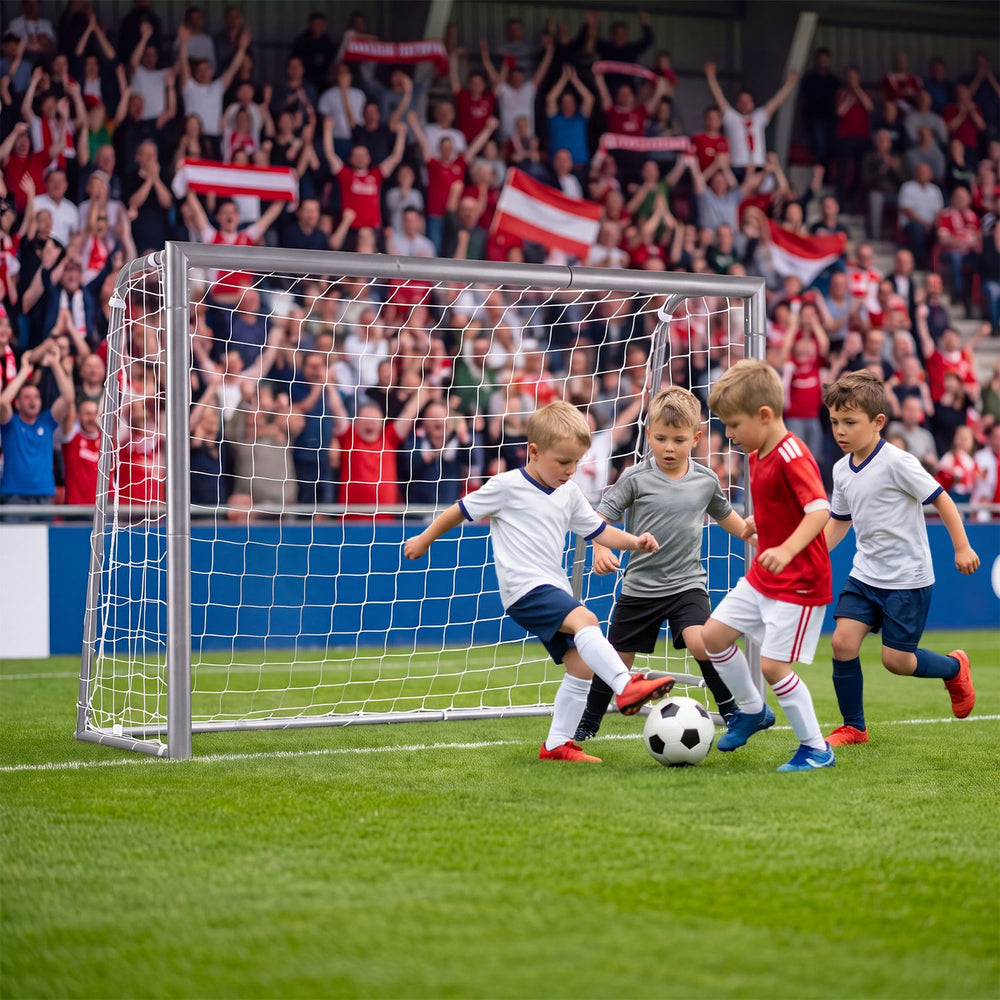 Kids soccer goal with tear-resistant net shown during a children’s match, with galvanized tube frame on the field.
