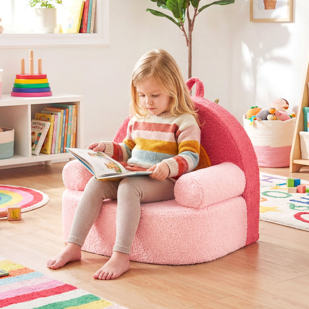 Kids sofa in red with soft fleece fabric, featuring a wide backrest and armrests, perfect for reading and playtime.