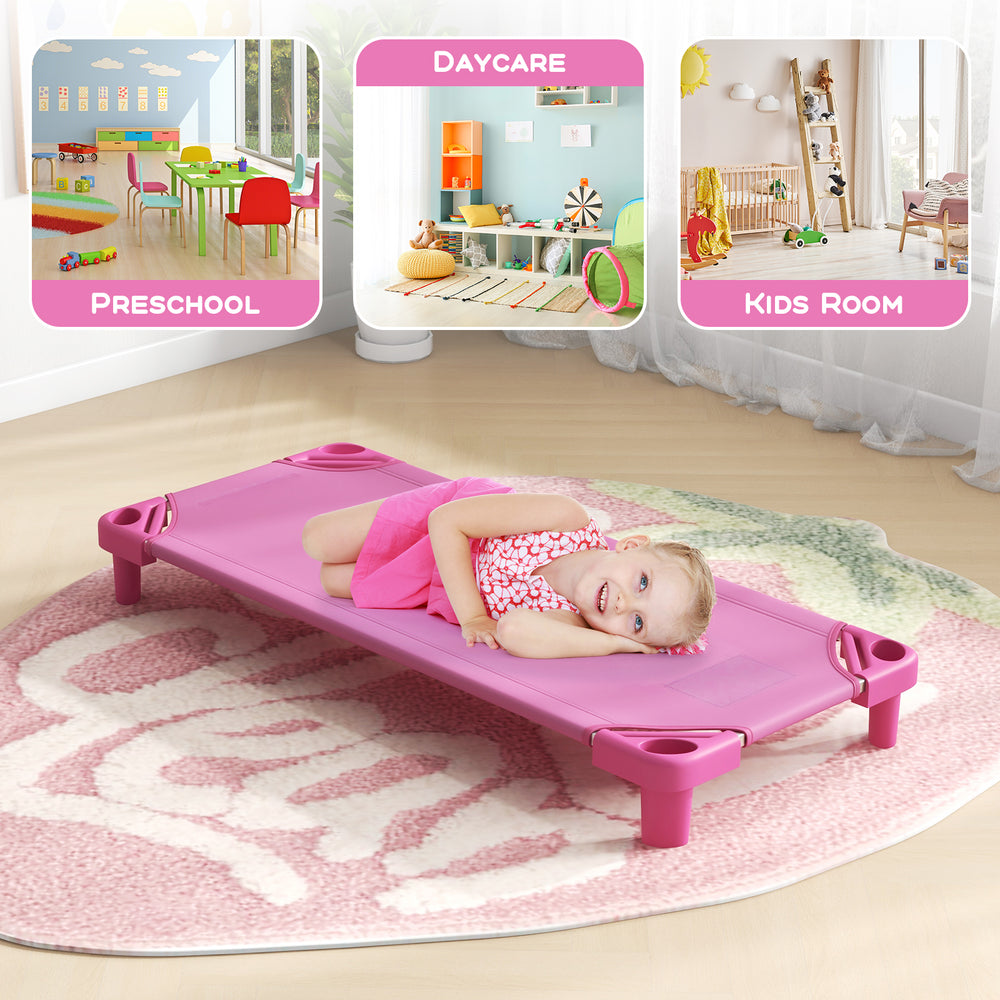Pink kids stackable daycare cot with detachable Oxford cloth, ideal for preschool and daycare settings, shown in a cozy.