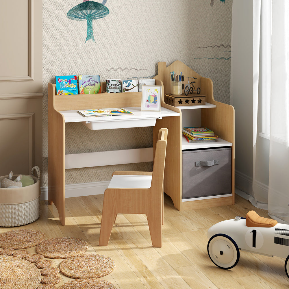 Kids study desk and chair set in natural wood with open shelves, drawer, and fabric storage bin for organized play.