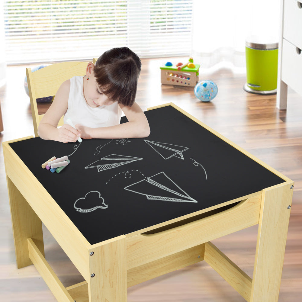 Kids table and chair set with blackboard surface, ideal for drawing and writing, featuring storage boxes for toys.
