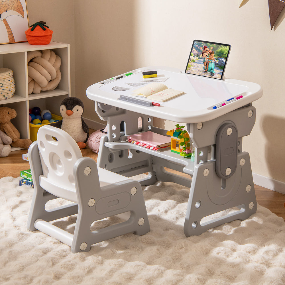 Height adjustable kids table and chair set in gray with a tiltable whiteboard, ideal for drawing and studying.