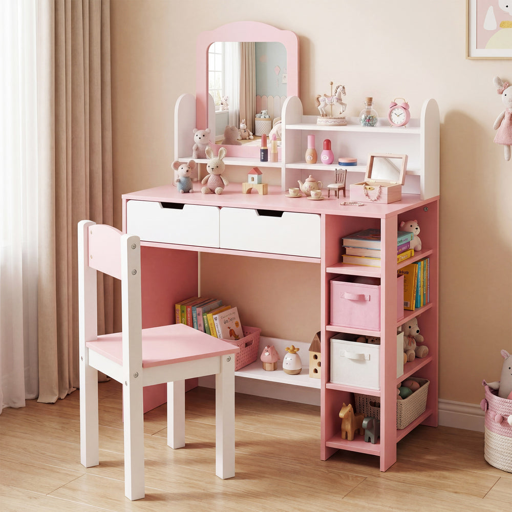 Kids vanity set in white and pink featuring a mirror, storage shelves, and drawers, ideal for a child's room.