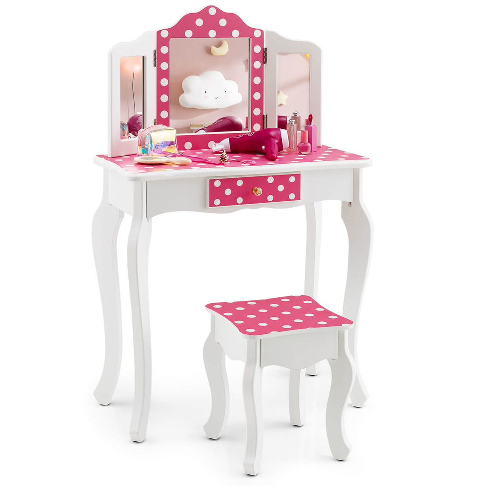 Kids vanity table and stool set in pink with polka dots, featuring a tri-fold mirror and ample storage for accessories.