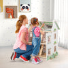 Kids Wooden Dollhouse in pink with removable roofs, featuring multiple rooms and furniture for imaginative play.