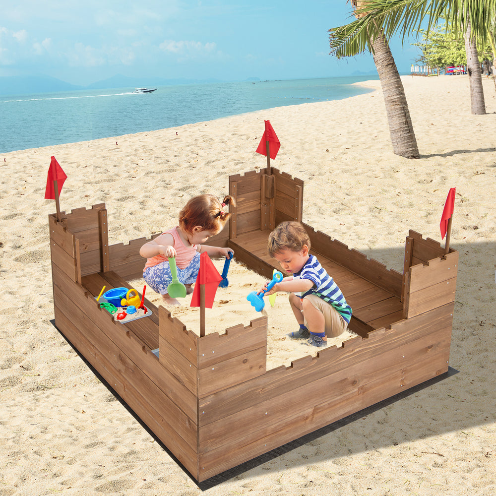 Kids wooden sandbox with red flags, solid cedar wood, large play area for 2 kids, includes ground liner and storage.
