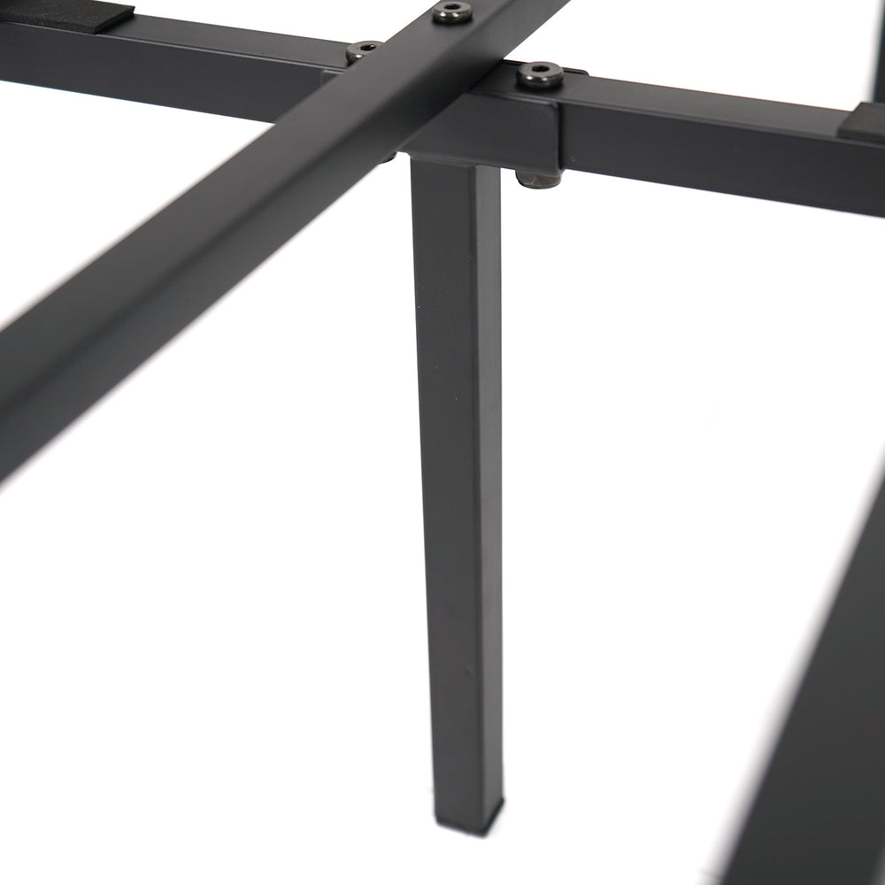 Close-up of the heavy-duty metal bed frame's support slats and legs, designed for stability and mattress support.