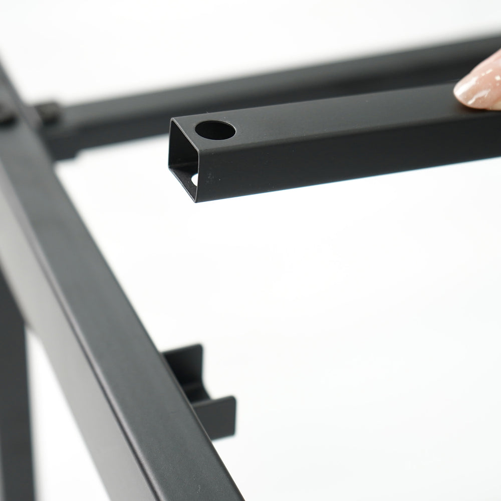 Close-up of the heavy-duty metal bed frame's slat connection, featuring a minimalist design for stable mattress support.
