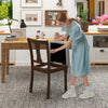Brown kitchen dining chair with linen fabric and flip-up seat for storage, showcased in a stylish home setting.
