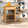 Kitchen island cart on wheels with bamboo frame, featuring spacious storage, lockable wheels, and towel rack for.