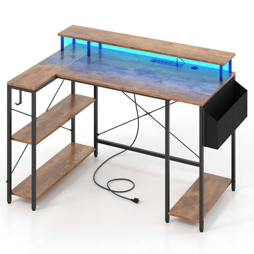 L-shaped gaming desk in rustic brown with LED lights, power outlets, and storage shelves for an organized workspace.