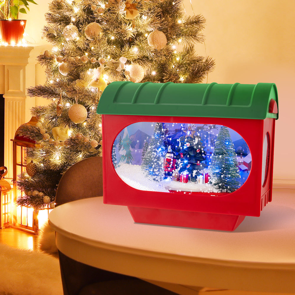 Sound-activated snow globe lantern in red with colorful lights and Christmas scenes, perfect for festive decoration.