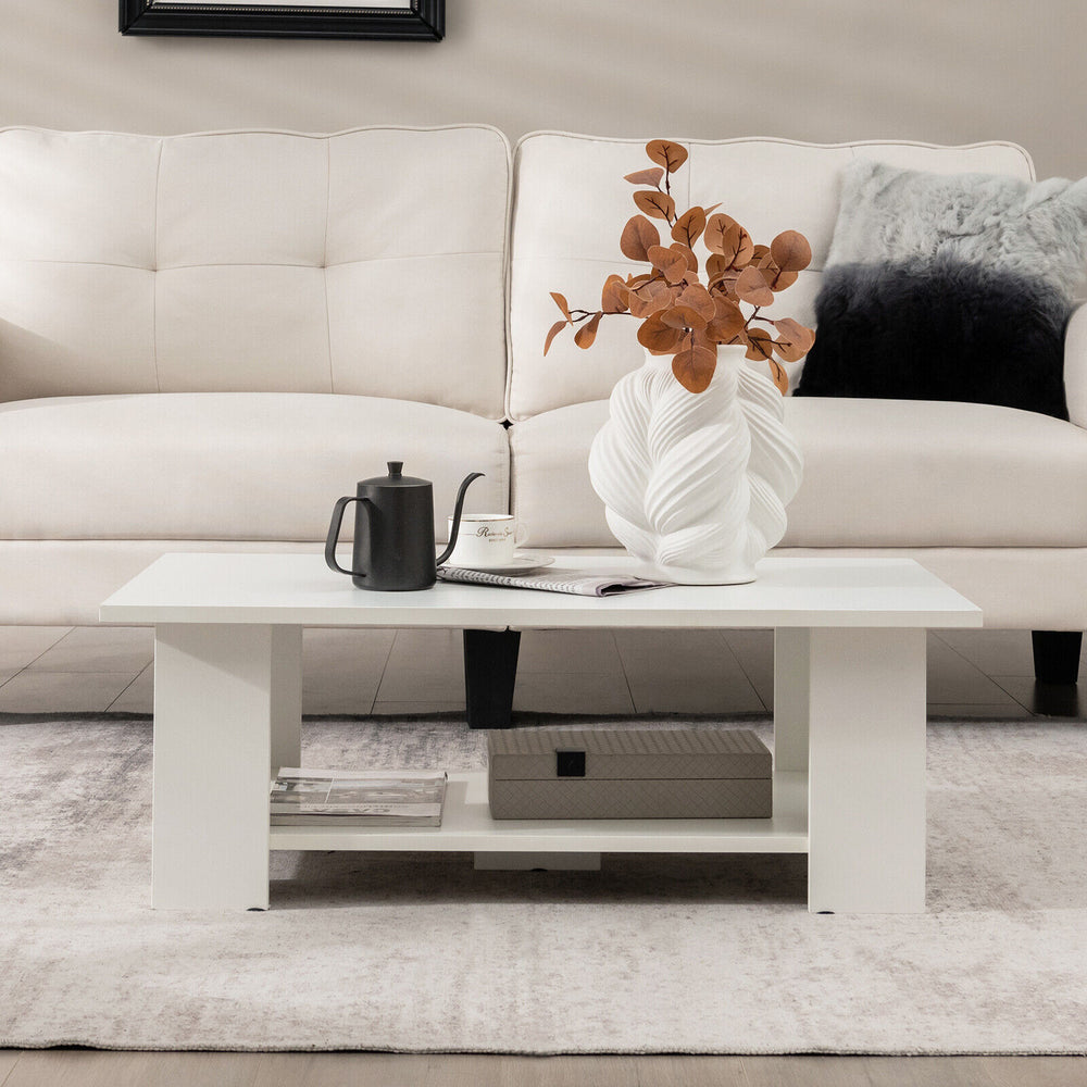 Large white 36-inch modern coffee table with storage shelf, featuring a smooth surface and elegant design for versatile.