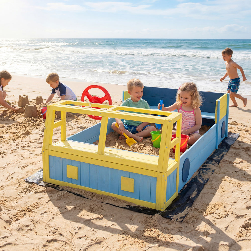 Large car-themed sandbox in blue with fir wood frame, perfect for imaginative play at the beach for kids.