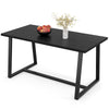 Large black dining table with a heavy-duty metal frame, ideal for 4-6 people, perfect for dining or office use.