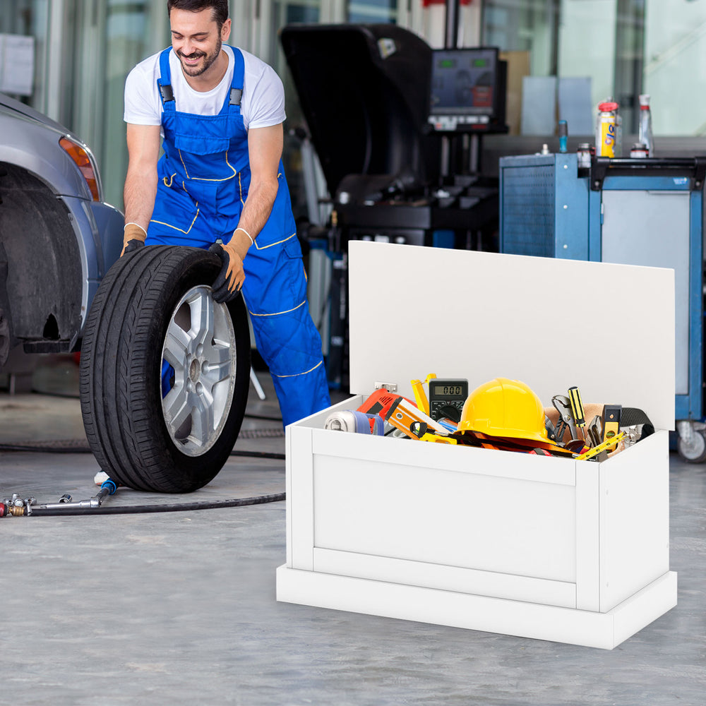 Large off-white storage chest with tools and safety metal hinge, ideal for organizing garage or workshop items.