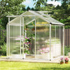Large walk-in greenhouse with polycarbonate panels and rain gutters, designed for year-round plant protection and.