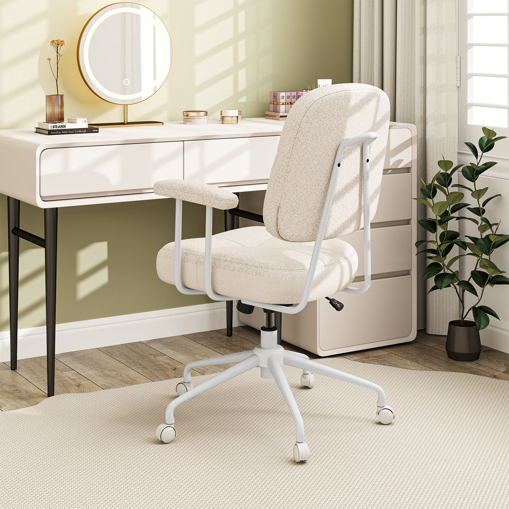Beige Leathaire upholstered task chair with cushioned back, ergonomic design, and rolling casters for home office use.