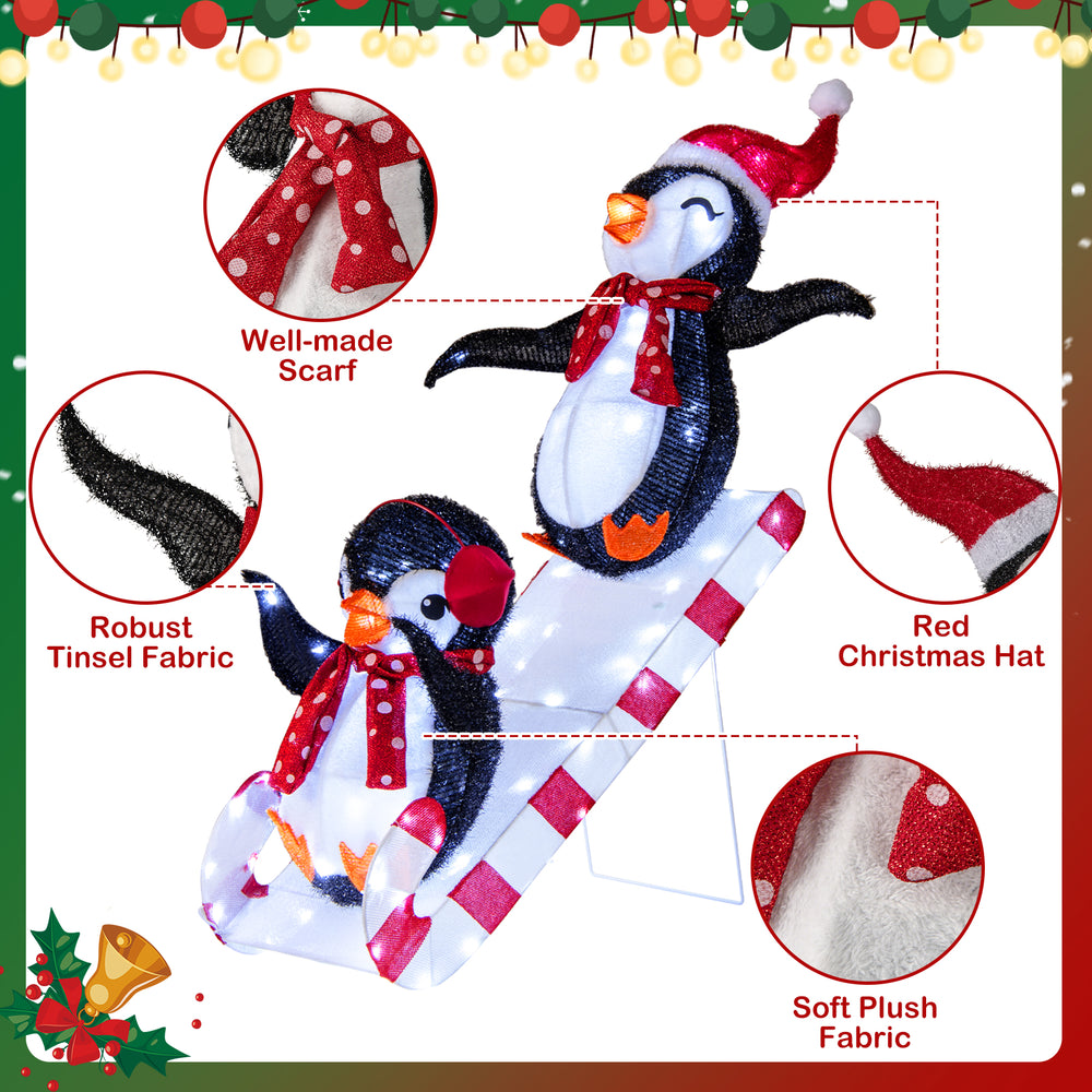 3D lighted Christmas decoration featuring penguins on a slide, equipped with 170 LED lights and sturdy fabric for.