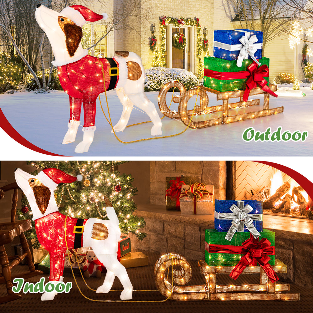 Festive indoor display of a pre-lit Xmas dog in Santa outfit with sleigh and presents, ideal for holiday decoration.