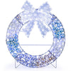 Lighted Christmas wreath decoration showcases a lighted bow and iridescent mesh, enhancing festive ambiance and cheer.