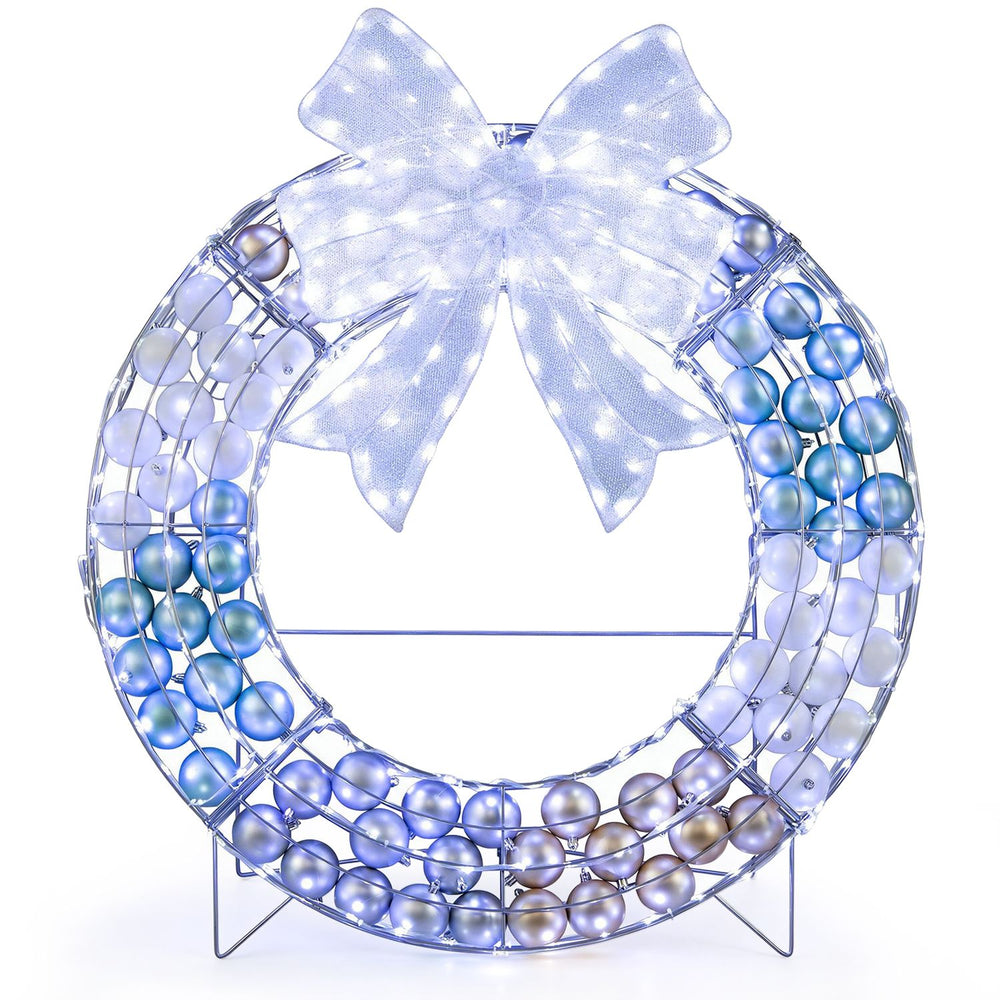 Lighted Christmas wreath decoration showcases a lighted bow and iridescent mesh, enhancing festive ambiance and cheer.