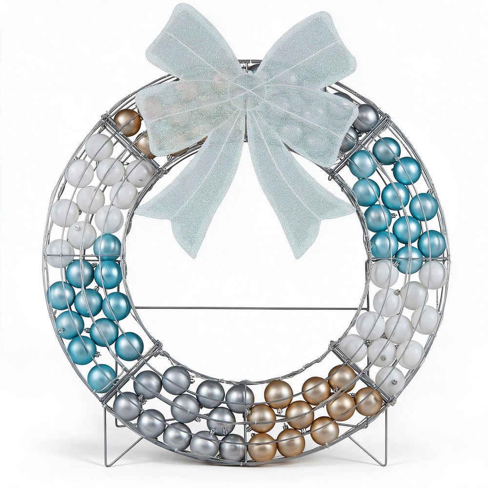 Lighted Christmas wreath decoration features 332 LED lights, 88 festive balls, and a freestanding design for holiday cheer.