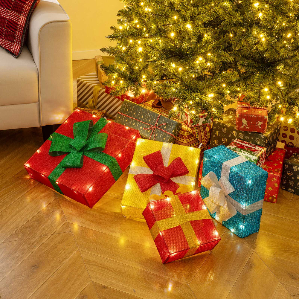Colorful lighted gift boxes with decorative bows, pre-lit for Christmas, perfect for indoor and outdoor holiday.