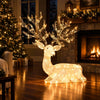 Kneeling Christmas reindeer with 280 warm white LED lights, featuring elegant antlers and a cute expression for festive decor.