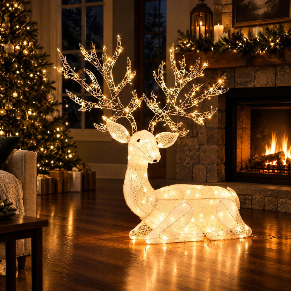 Kneeling Christmas reindeer with 280 warm white LED lights, featuring elegant antlers and a cute expression for festive decor.